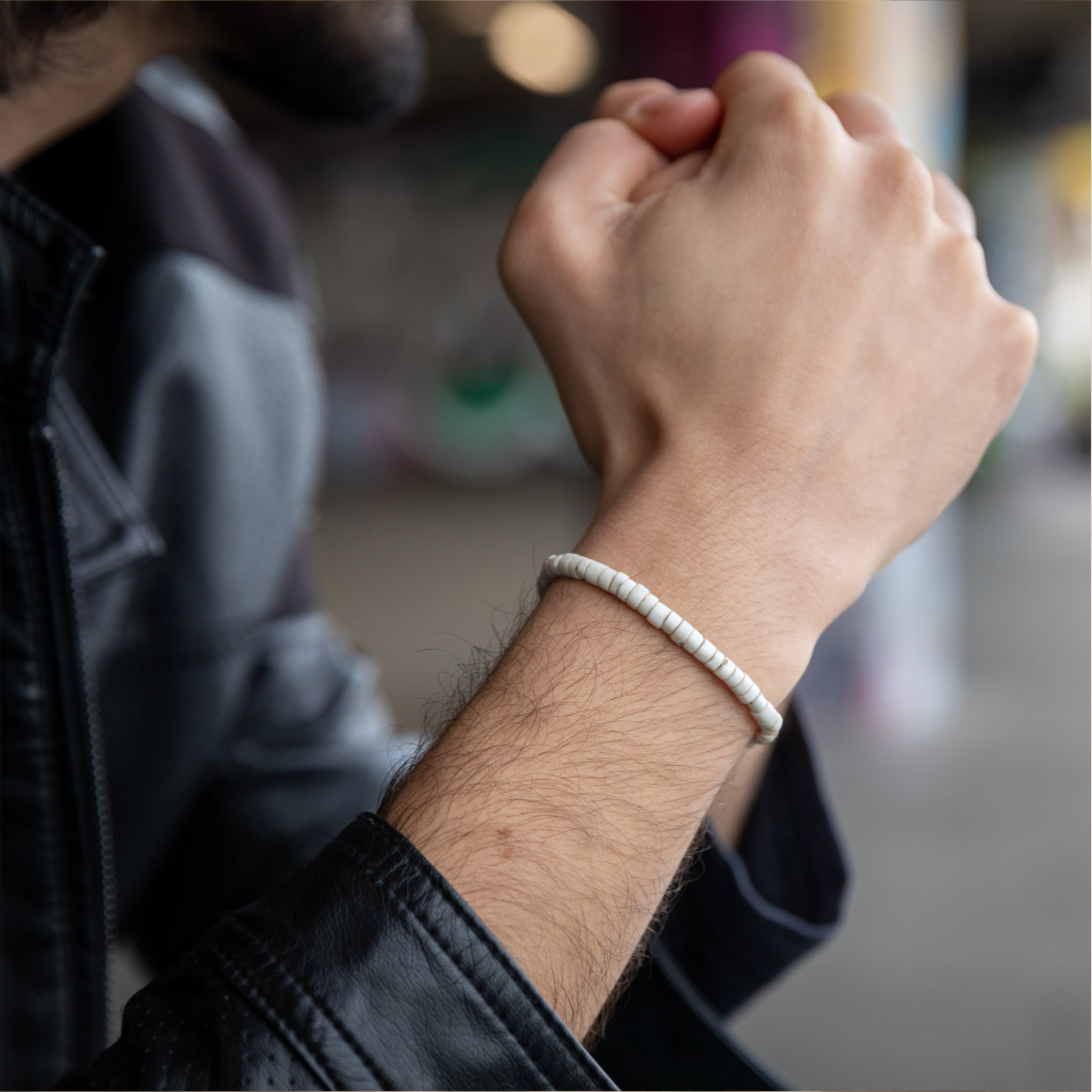 Man wearing Accent Goomba Bead Bracelet